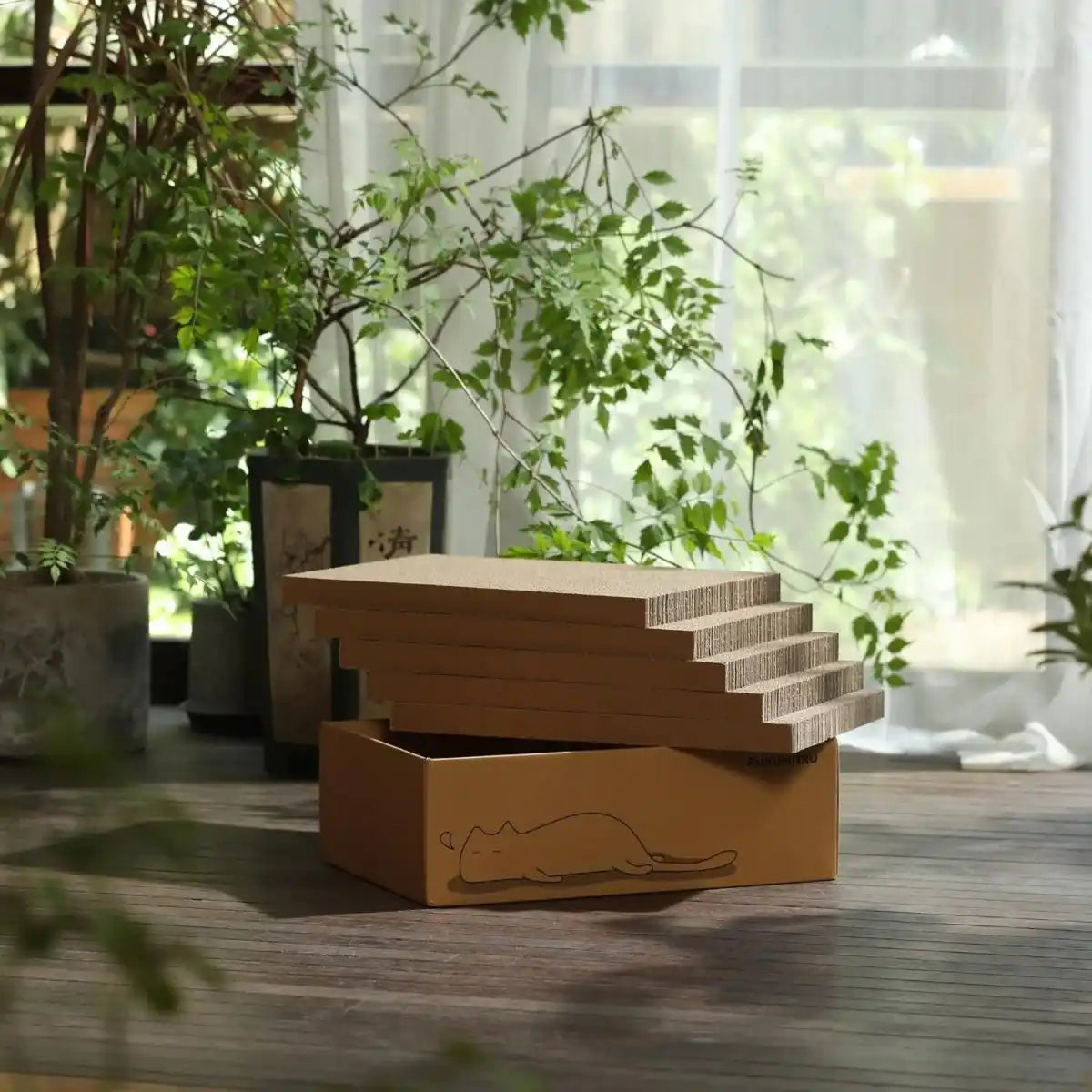 Cardboard Cat Scratcher House for indoor pets, featuring five durable scratching boards and cottage design.