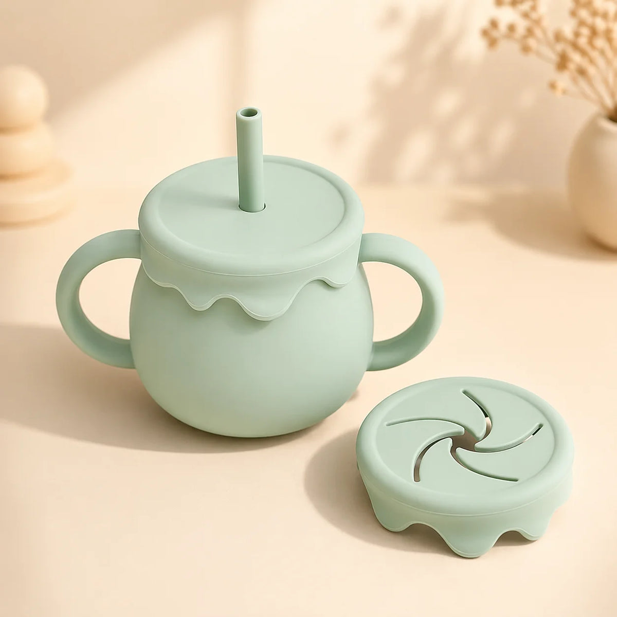 A durable, spill-proof silicone baby sippy cup designed with handles for toddler transition feeding.