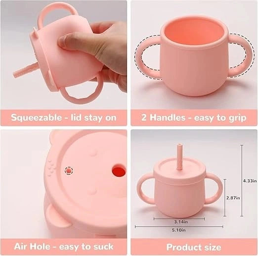 Pink silicone baby sippy cup with its squeezable lid, two handles, air hole and size measurements labelled